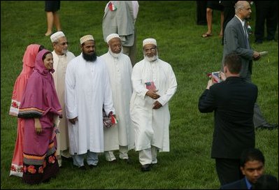Invited guest attending the official arrival of India's Prime Minister Dr. Manmohan Singh, pose Monday, July 18, 2005, for a photo on the South Lawn of the White House. 