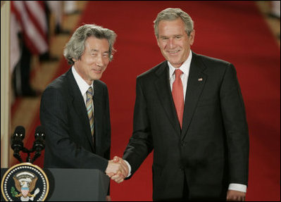 President George W. Bush shakes hands with Japan’s Prime Minister Junichiro Koizumi at the conclusion of their joint press availability Thursday, June 29, 2006, in the East Room of the White House.
