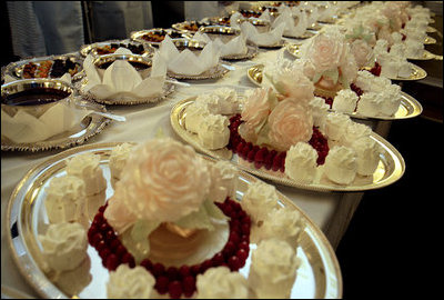 Trays of sweet rose blossoms are prepared for guests during the State Dinner for her Majesty Queen Elizabeth II of Great Britain and His Royal Highness The Prince Philip, Duke of Edinburgh, Monday, May 7, 2007. White House photo by Shealah Craighead