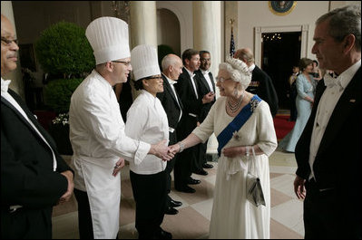 Her Majesty Queen Elizabeth II is joined by President George W. Bush as she thanks members of the White House staff at the conclusion of the State Dinner in her honor Monday, May 7, 2007. White House photo by Eric Draper