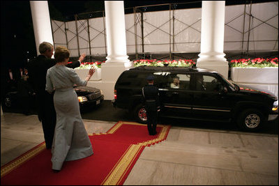 President George W. Bush and Mrs. Laura Bush wave as Her Majesty Queen Elizabeth II and His Royal Highness The Prince Philip, Duke of Edinburgh, leave the White House Monday evening, May 7, 2007, at the conclusion of the State Dinner in honor of the Queen's visit to Washington, D.C. White House photo by Eric Draper