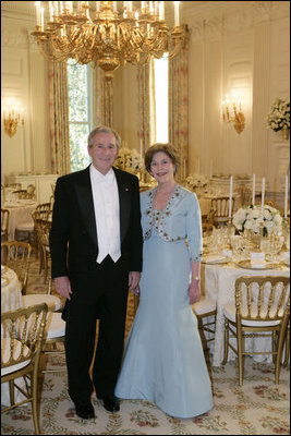 President George W. Bush and Mrs. Laura Bush pose for a photo after viewing the State Dining Room prior to welcoming Her Majesty Queen Elizabeth II and His Royal Highness The Prince Philip, Duke of Edinburgh, Monday, May 7, 2007, to the White House for a State Dinner in the Queen’s honor. White House photo by Eric Draper