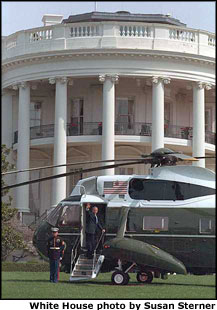 George W. Bush waves goodbye as he leaves for the Summit of the Americas in Quebec, Canada.