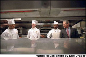 During his first week in office, President George W. Bush meets the culinary staff of the White House Mess.