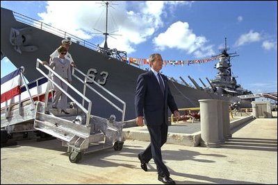 President and Laura Bush tour the USS Missouri at Pearl Harbor Oct. 23, 2003. Commissioned in 1944, the "Mighty Mo" served in the Pacific theater of World War II and was the site of Japan's surrender to Allied Forces Sept. 2, 1945. After several more deployments, including a Persian Gulf tour in 1991, the battleship the battleship served its final mission when it returned to Pearl Harbor to commemorate the 50th anniversary of the infamous attack.
