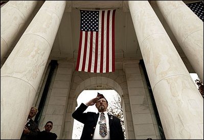 During Veterans Day ceremonies held at the Arlington National Cemetery Nov. 11, 2003, a veteran salutes during President Bush.s remarks. "We observe Veterans Day on an anniversary -- not of a great battle or of the beginning of a war, but of a day when war ended and our nation was again at peace," said the President. "Ever since the Armistice of November the 11th, 1918, this has been a day to remember our debt to all who have worn the uniform of the United States."
